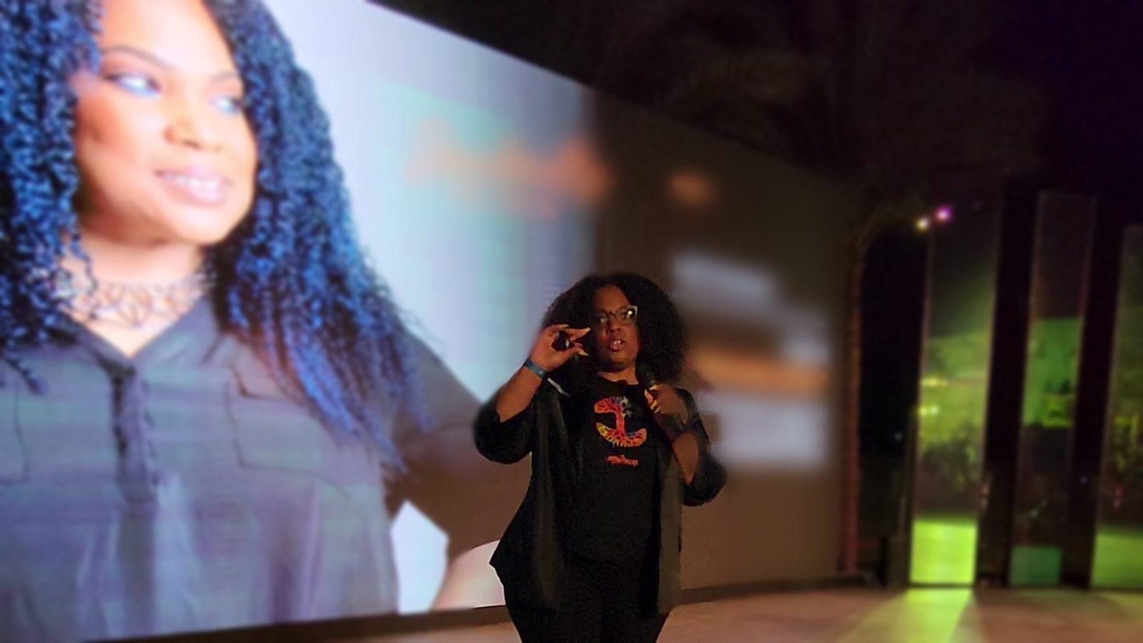 Nina Thomas speaking on the open-air RiseUp Summit stage in Cairo, 2023