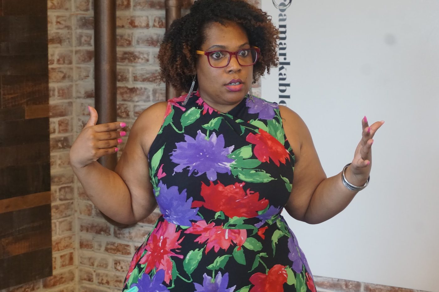 Nina Thomas teaching a room, mid-explanation